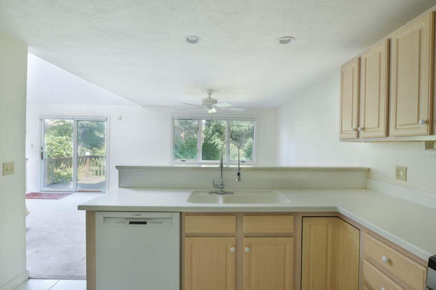 3 Kettle Lane Mashpee, MA 02649 - Photo 11 of 27 a kitchen with a sink and a window