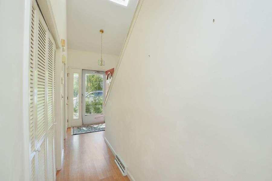 3 Kettle Lane Mashpee, MA 02649 - Photo 16 of 27 a view of a hallway with wooden floor and a bathroom