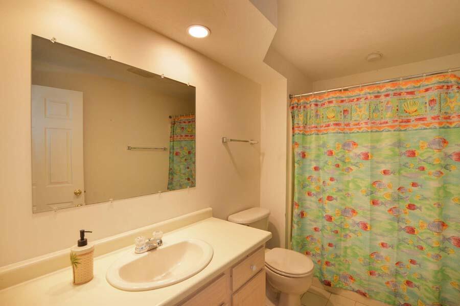 3 Kettle Lane Mashpee, MA 02649 - Photo 21 of 27 a bathroom with a sink a toilet and shower curtain