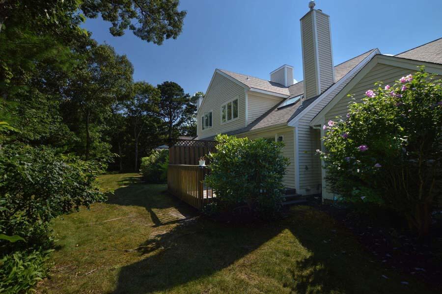 3 Kettle Lane Mashpee, MA 02649 - Photo 24 of 27 a backyard of a house with lots of green space
