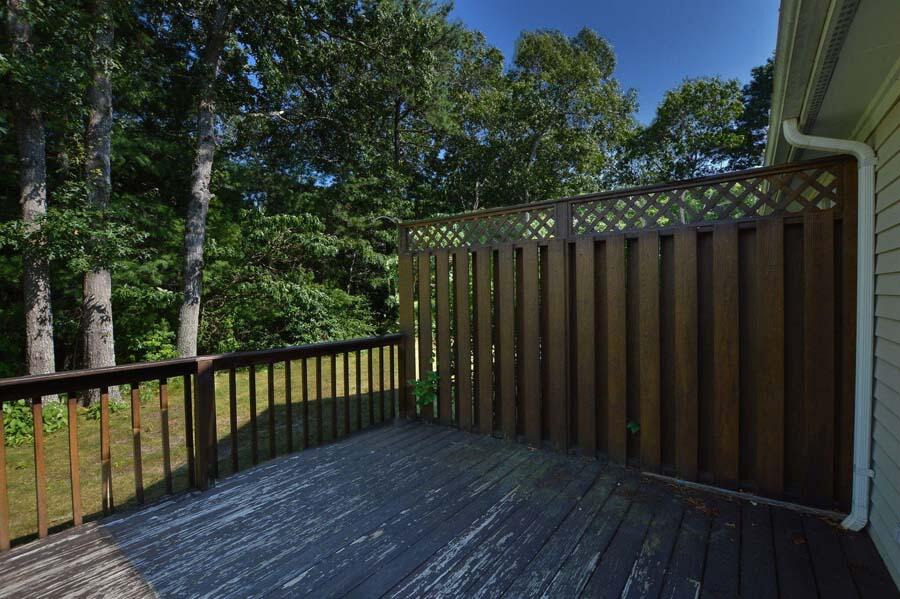 3 Kettle Lane Mashpee, MA 02649 - Photo 7 of 27 a wooden deck with trees in front of it