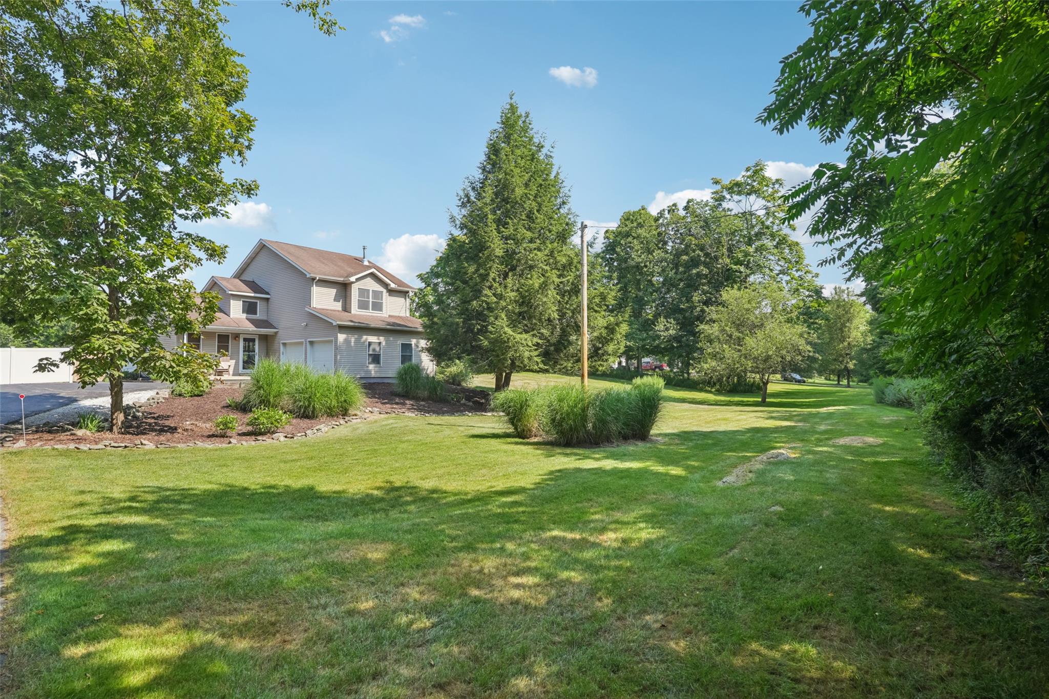 904 West Kaisertown Road Montgomery, NY 12549 - Photo 1 of 1 a view of a house with a big yard and a large trees