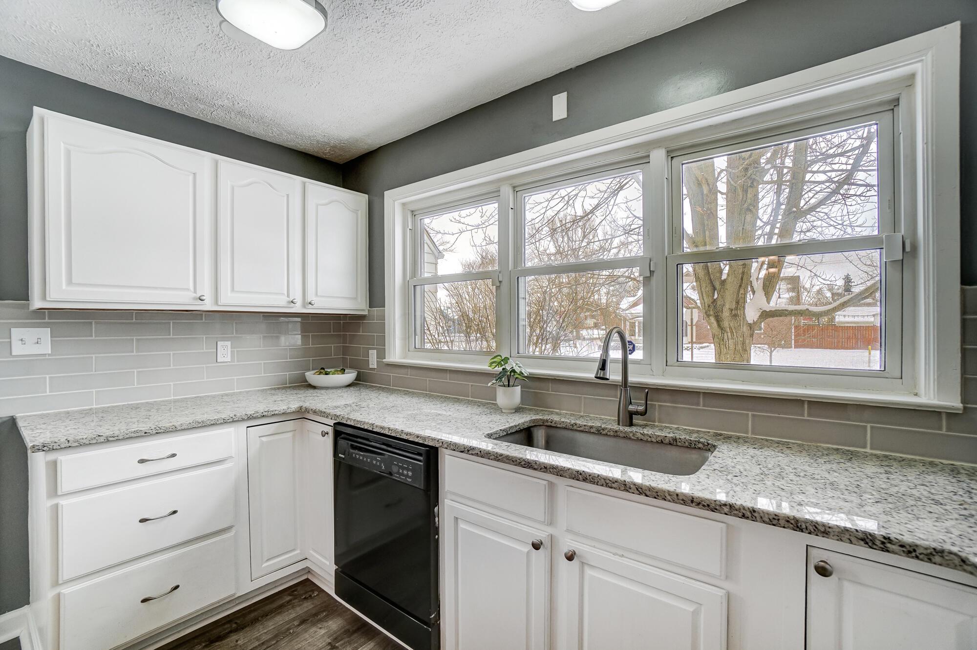 2990 Parkside Road Columbus, OH 43204 - Photo 11 of 34 Lovely large kitchen with wonderful windows above the giant sink.