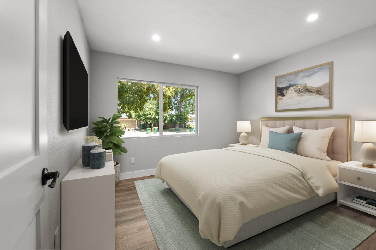 212 East Longview Avenue Stockton, CA 95207 - Photo 14 of 34 a bedroom with a large bed and a large window