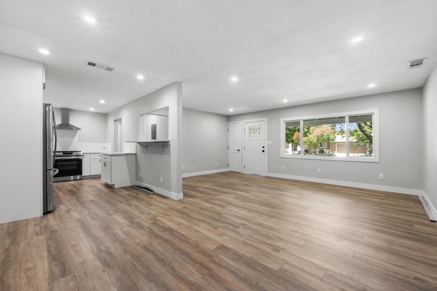 212 East Longview Avenue Stockton, CA 95207 - Photo 18 of 34 a view of a kitchen with a refrigerator and a window
