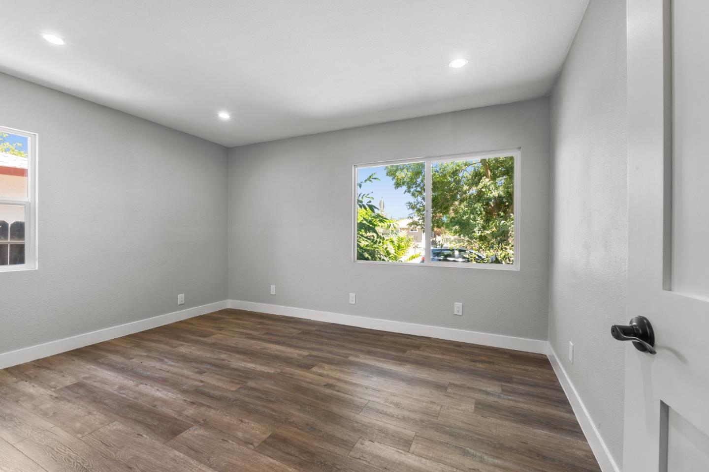 212 East Longview Avenue Stockton, CA 95207 - Photo 23 of 34 wooden floor in an empty room with a window