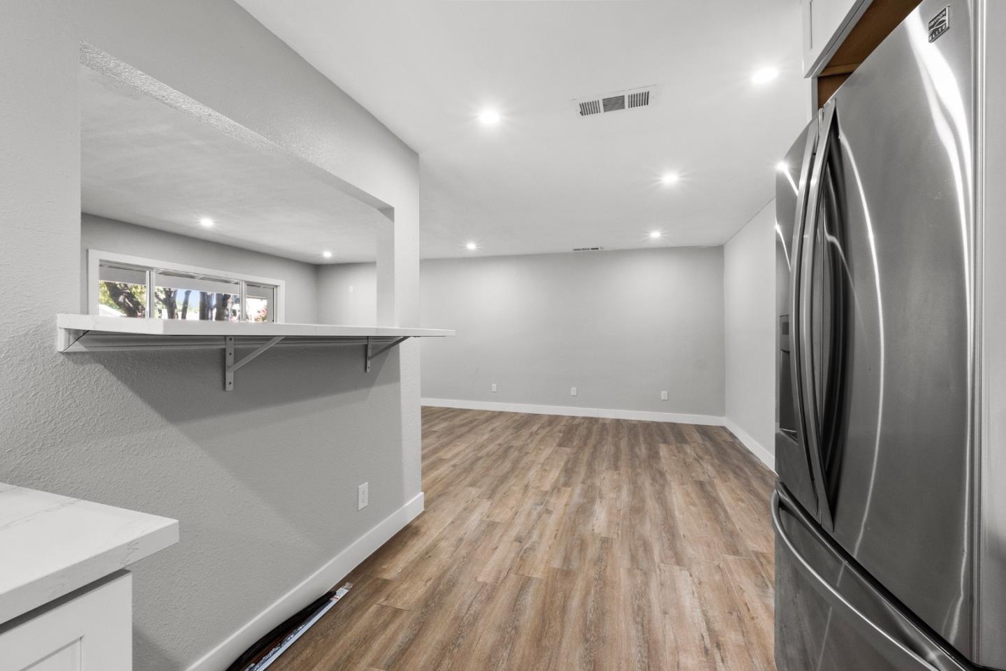 212 East Longview Avenue Stockton, CA 95207 - Photo 25 of 34 a view of a kitchen with a sink and refrigerator