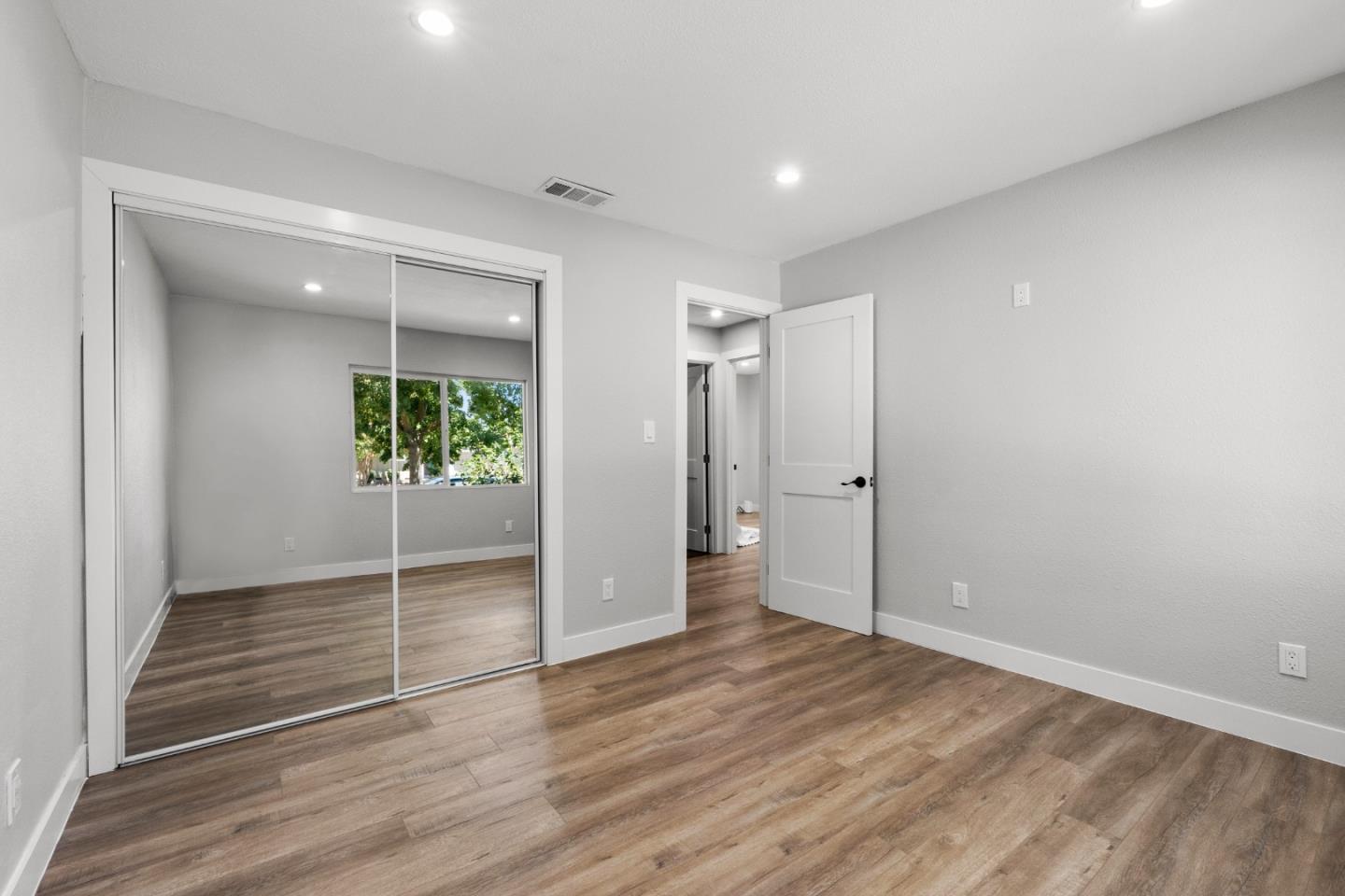 212 East Longview Avenue Stockton, CA 95207 - Photo 27 of 34 wooden floor in an empty room with a window
