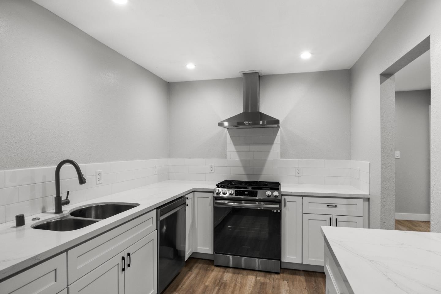 212 East Longview Avenue Stockton, CA 95207 - Photo 7 of 34 a kitchen with stainless steel appliances a sink and cabinets