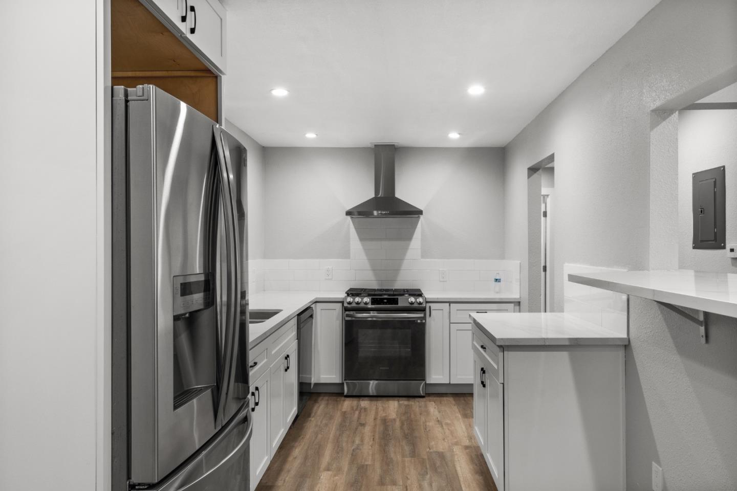 212 East Longview Avenue Stockton, CA 95207 - Photo 8 of 34 a kitchen with stainless steel appliances a refrigerator a stove a sink and a refrigerator