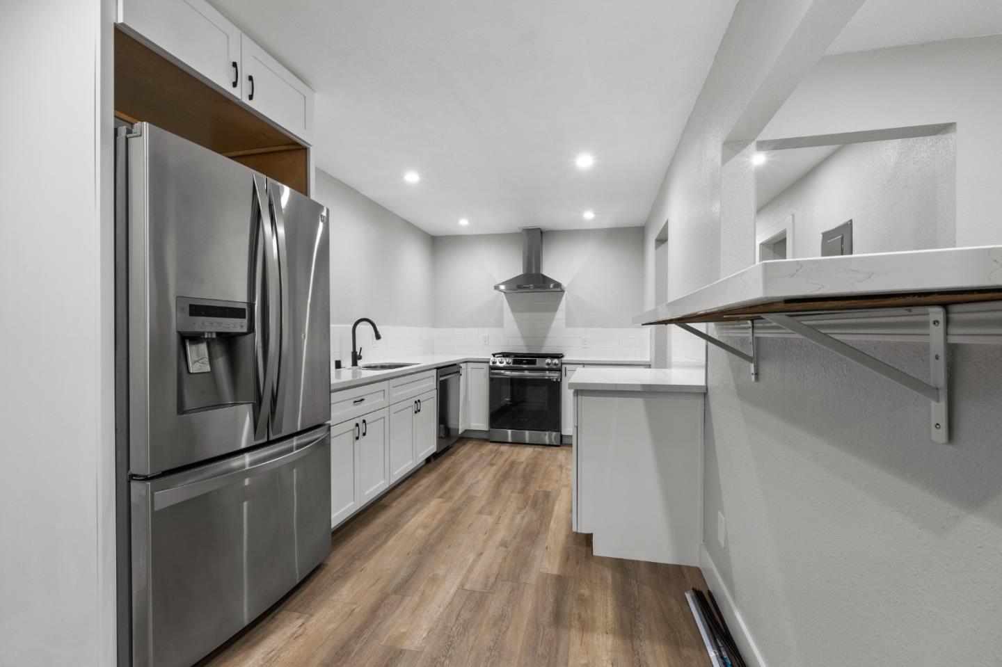 212 East Longview Avenue Stockton, CA 95207 - Photo 9 of 34 a kitchen with cabinets and stainless steel appliances