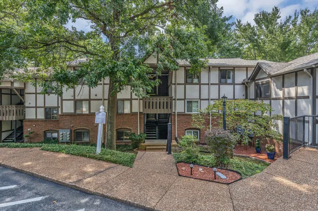 front view of a house with a garden