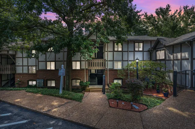 a front view of a house with yard