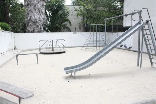 a view of multiple houses with palm trees