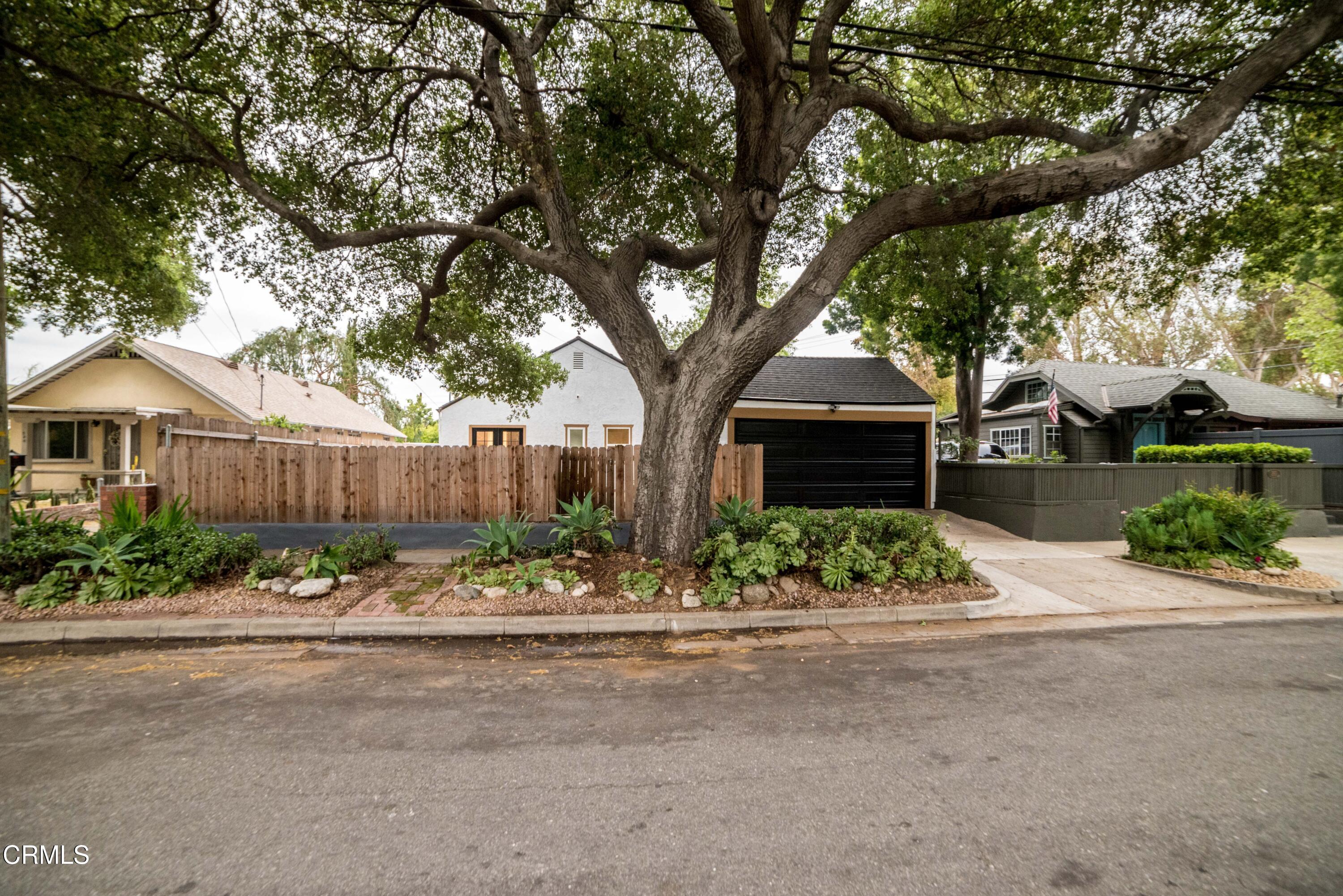 1132 Forest Avenue Pasadena, CA 91103 - Photo 2 of 3 a front view of a house with garden