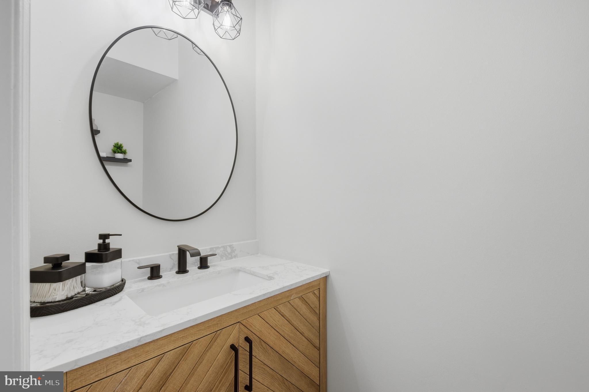 8575 Tyrolean Way Springfield, VA 22153 - Photo 12 of 29 a bathroom with a sink and a mirror