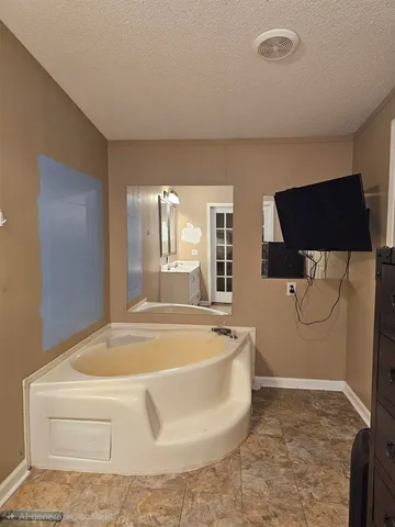 a view of a bathtub in a room