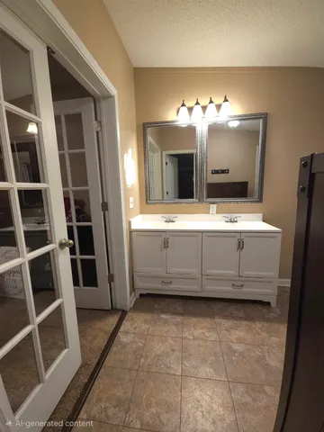 a bathroom with a double vanity sink and a mirror