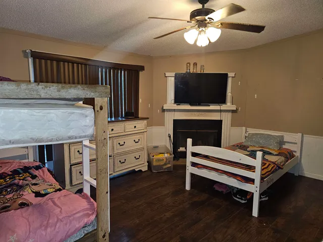 a bedroom with furniture and a fireplace