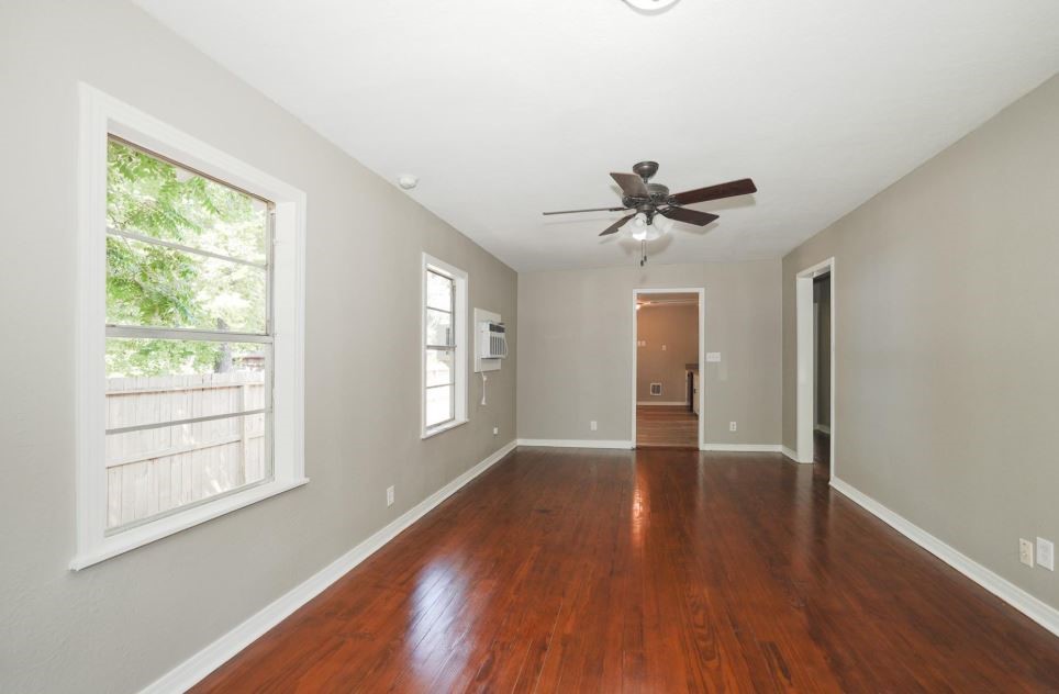 701 Clay Street Cleveland, TX 77327 - Photo 7 of 18 Refinished flooring in living room and bedrooms