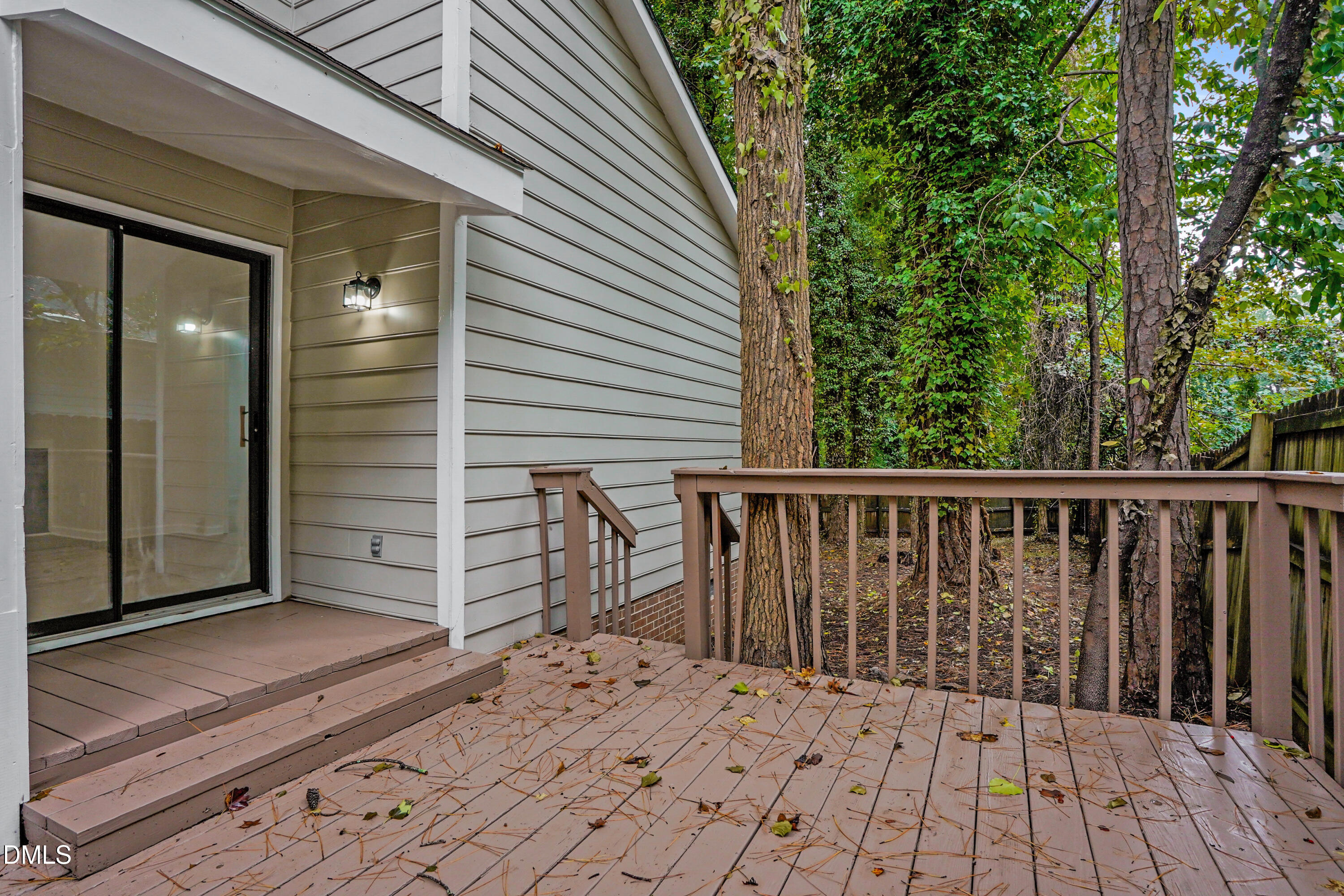 105 Stonelake Court Raleigh, NC 27610 - Photo 14 of 15 a balcony with wooden floor and fence