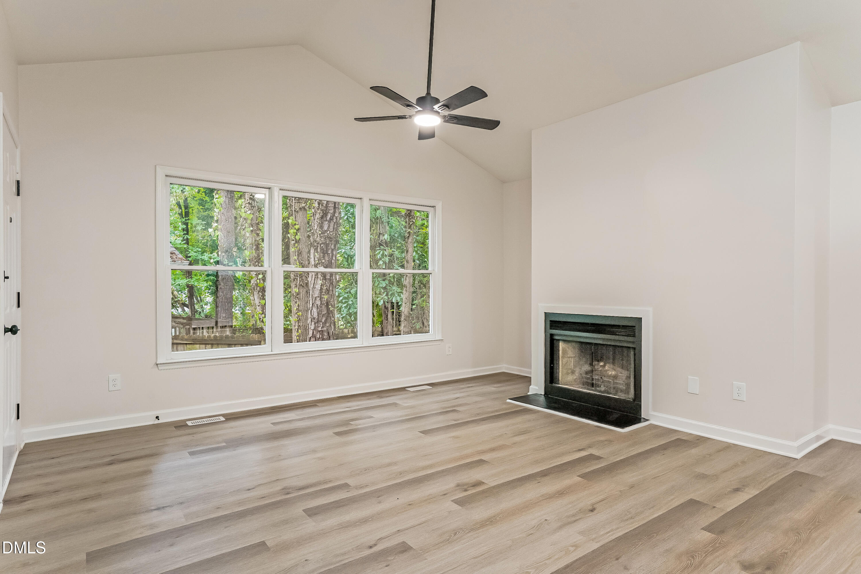 105 Stonelake Court Raleigh, NC 27610 - Photo 4 of 15 a view of empty room with wooden floor and fan