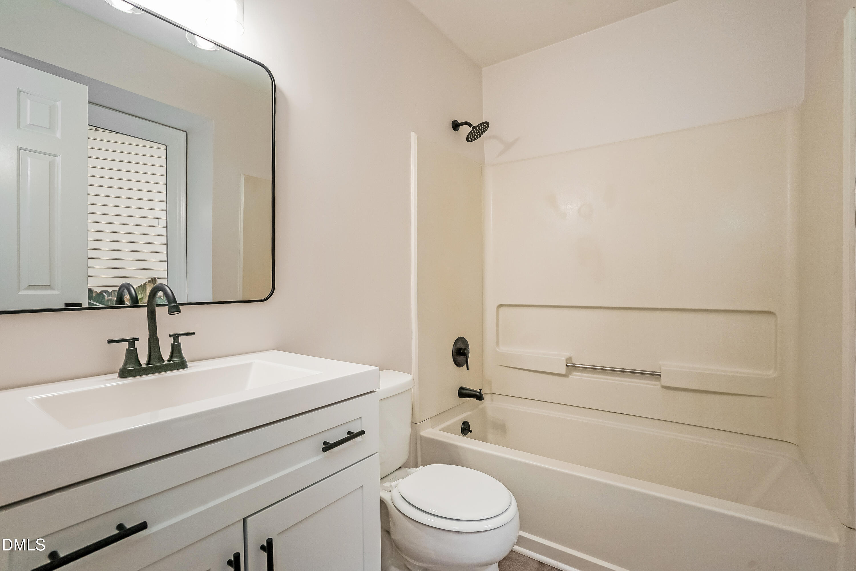 105 Stonelake Court Raleigh, NC 27610 - Photo 8 of 15 a bathroom with a sink a toilet and shower