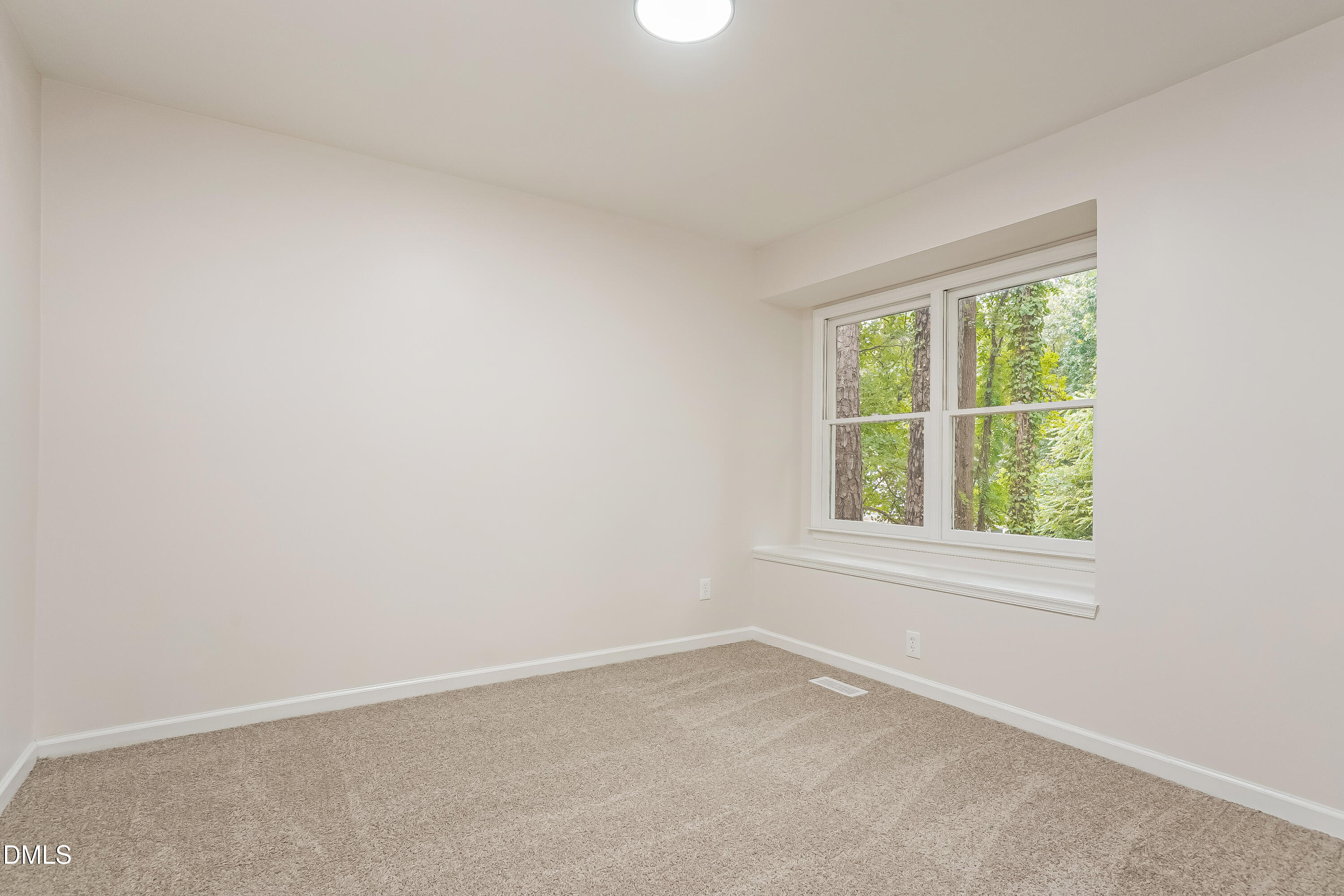 105 Stonelake Court Raleigh, NC 27610 - Photo 9 of 15 an empty room with a window