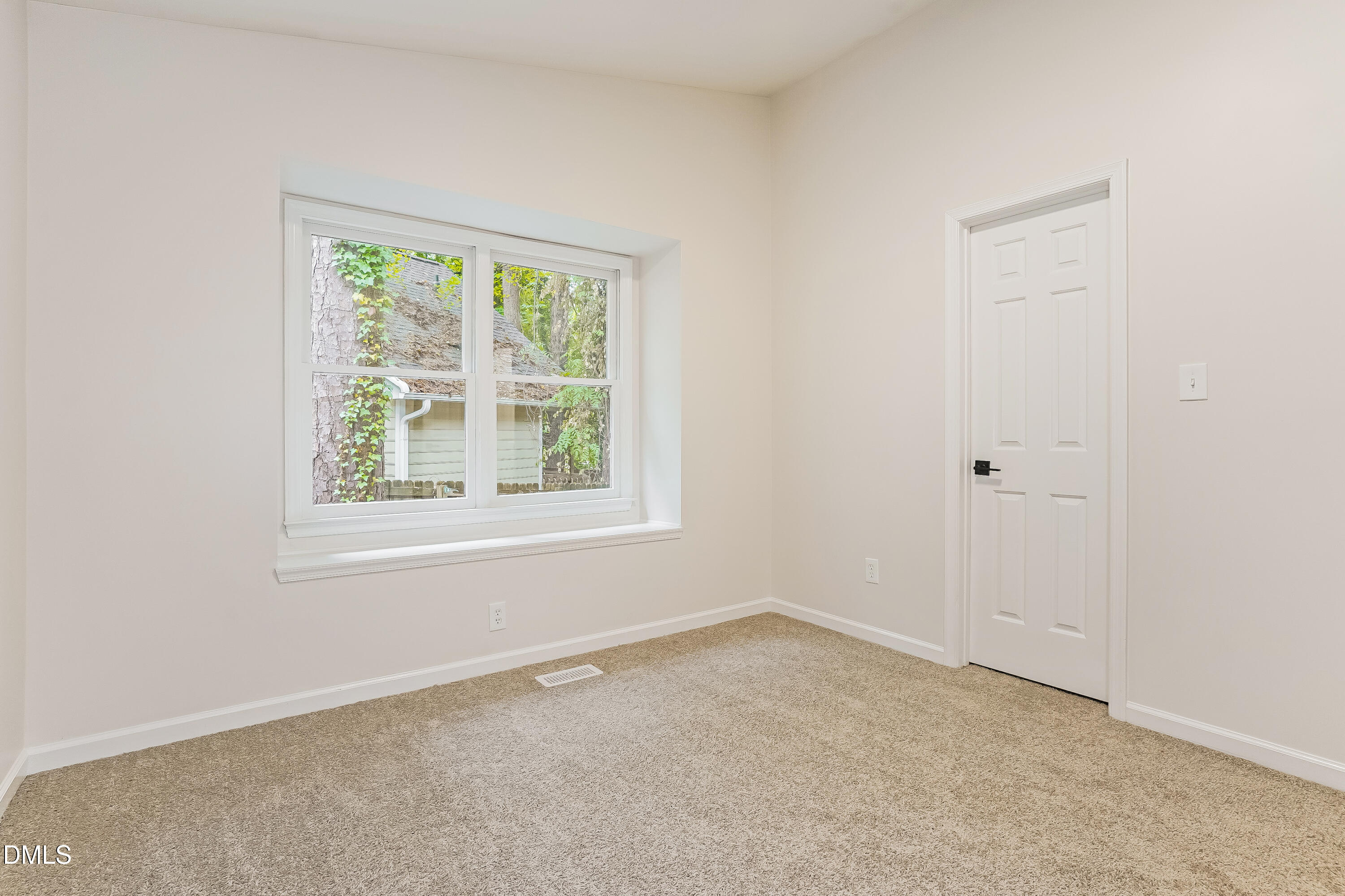105 Stonelake Court Raleigh, NC 27610 - Photo 10 of 15 an empty room with a window