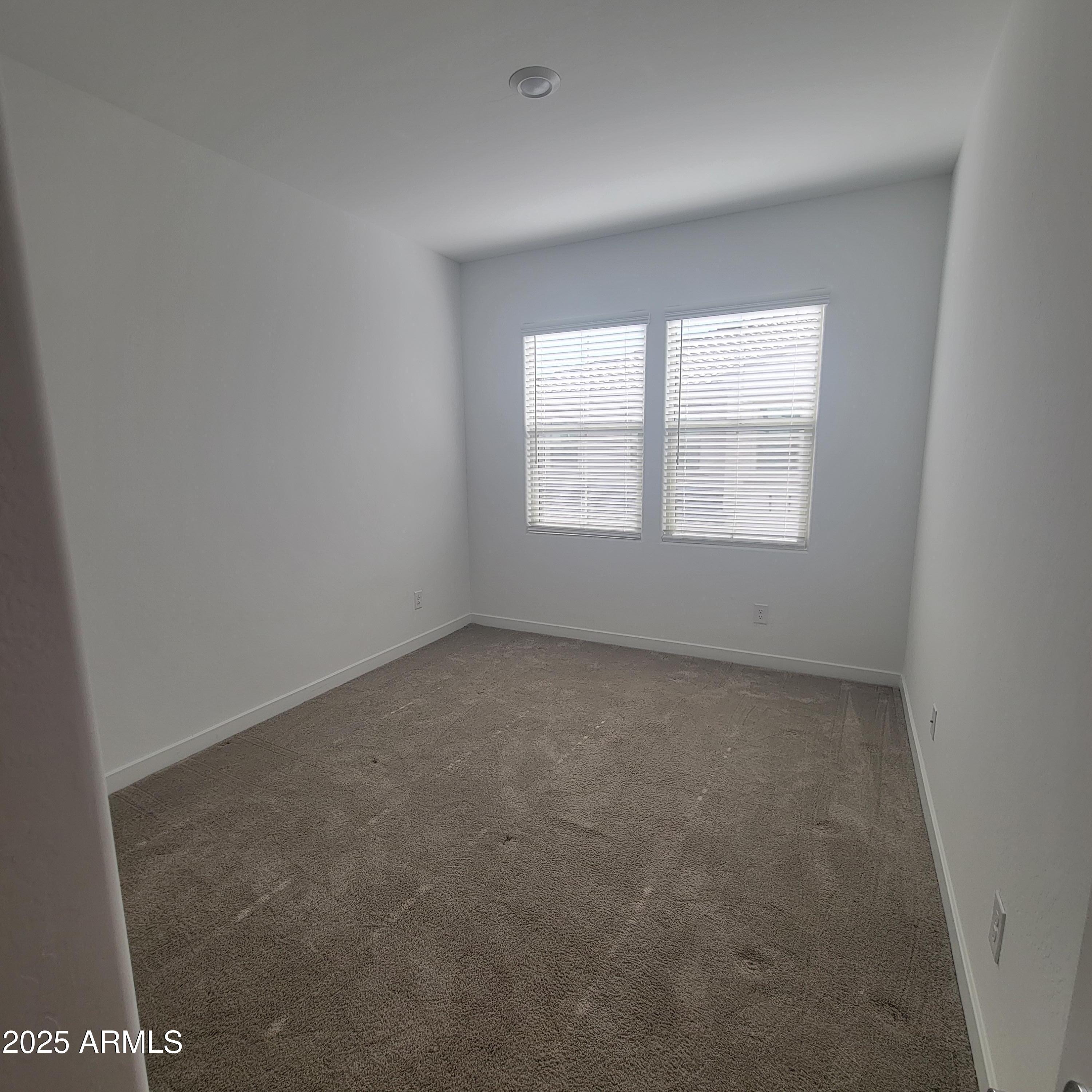 4077 South Sabrina Drive, Unit 30 Chandler, AZ 85248 - Photo 13 of 37 an empty room with a window