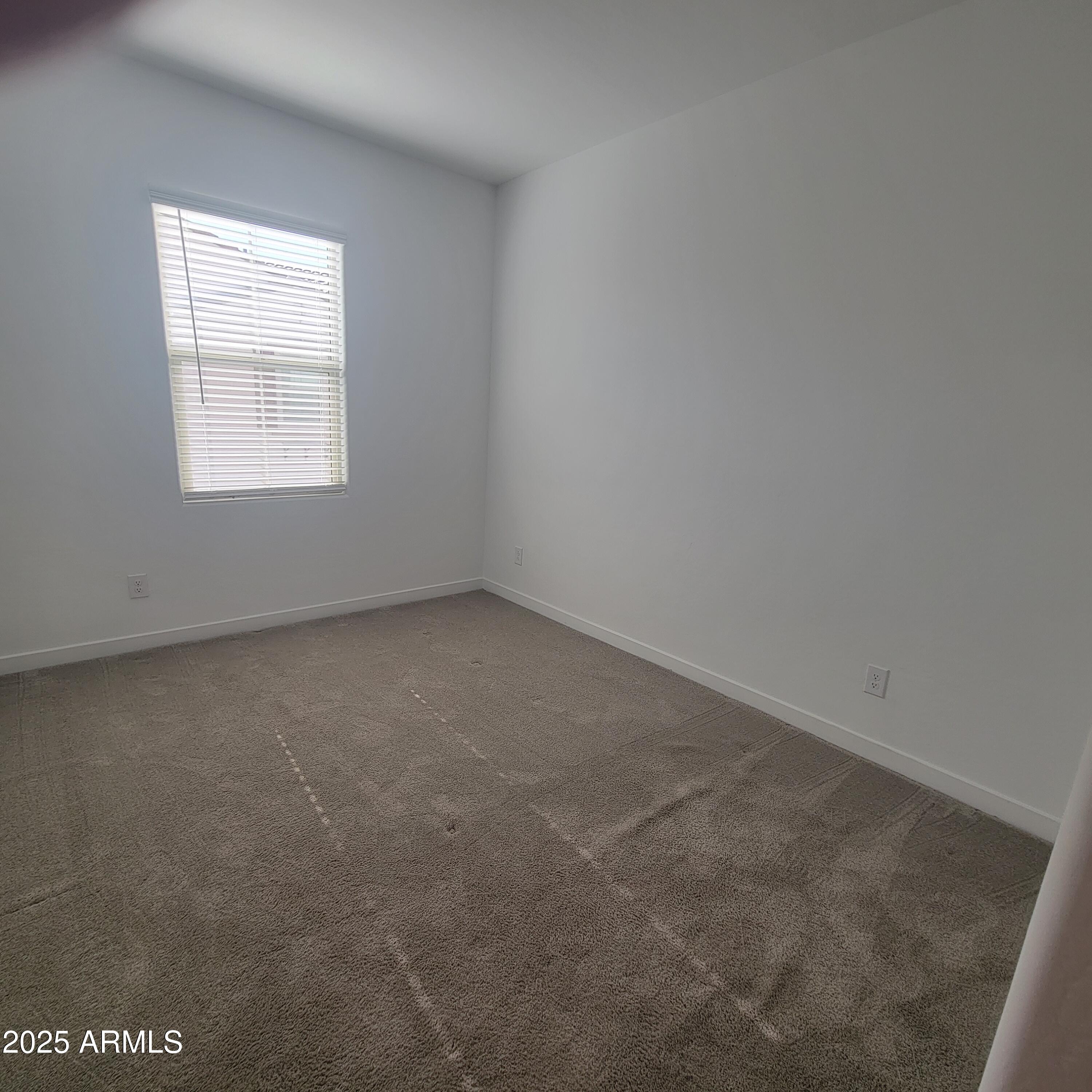 4077 South Sabrina Drive, Unit 30 Chandler, AZ 85248 - Photo 18 of 37 an empty room with a window