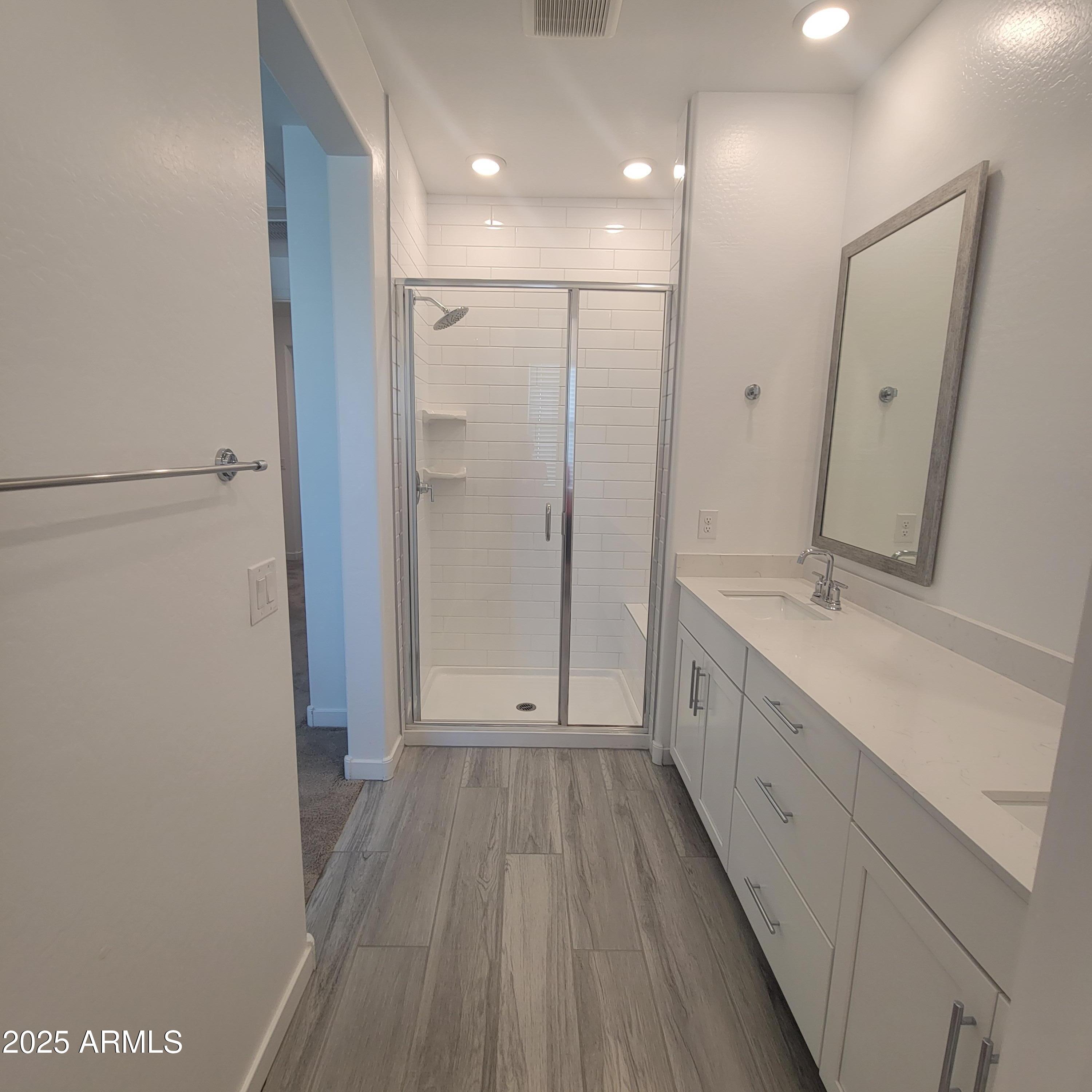 4077 South Sabrina Drive, Unit 30 Chandler, AZ 85248 - Photo 20 of 37 a spacious bathroom with a double vanity sink and a mirror