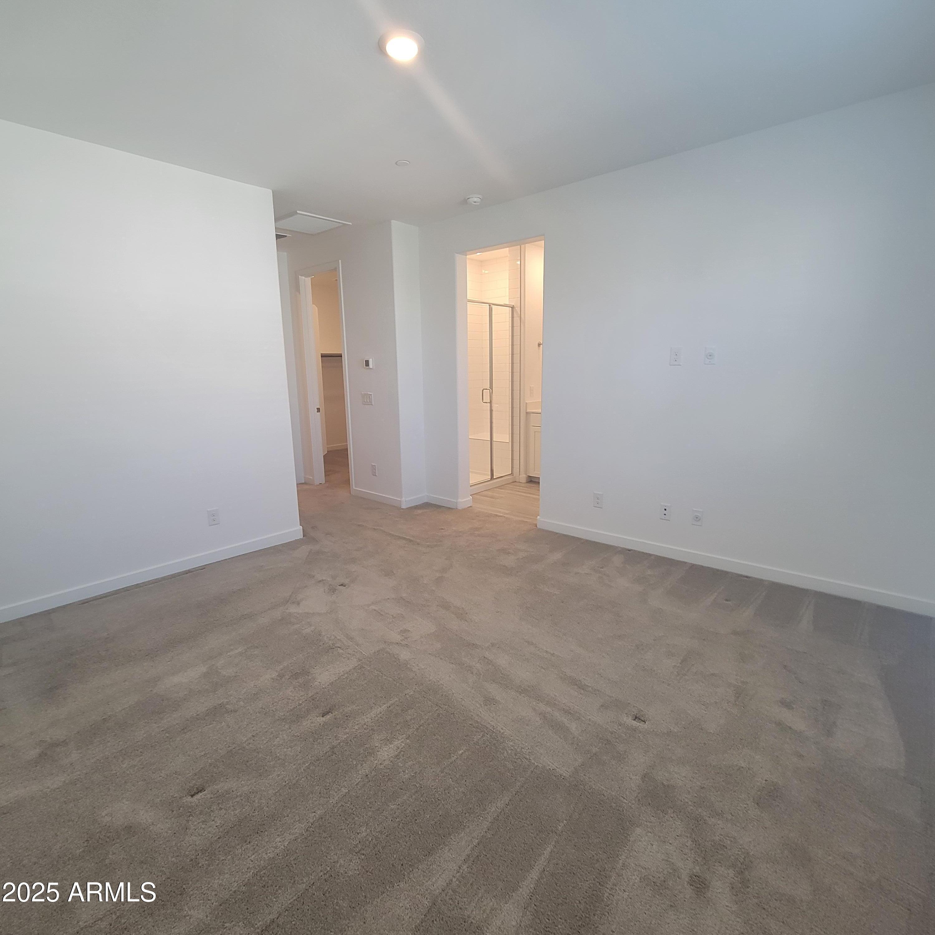 4077 South Sabrina Drive, Unit 30 Chandler, AZ 85248 - Photo 21 of 37 a view of an empty room with a window