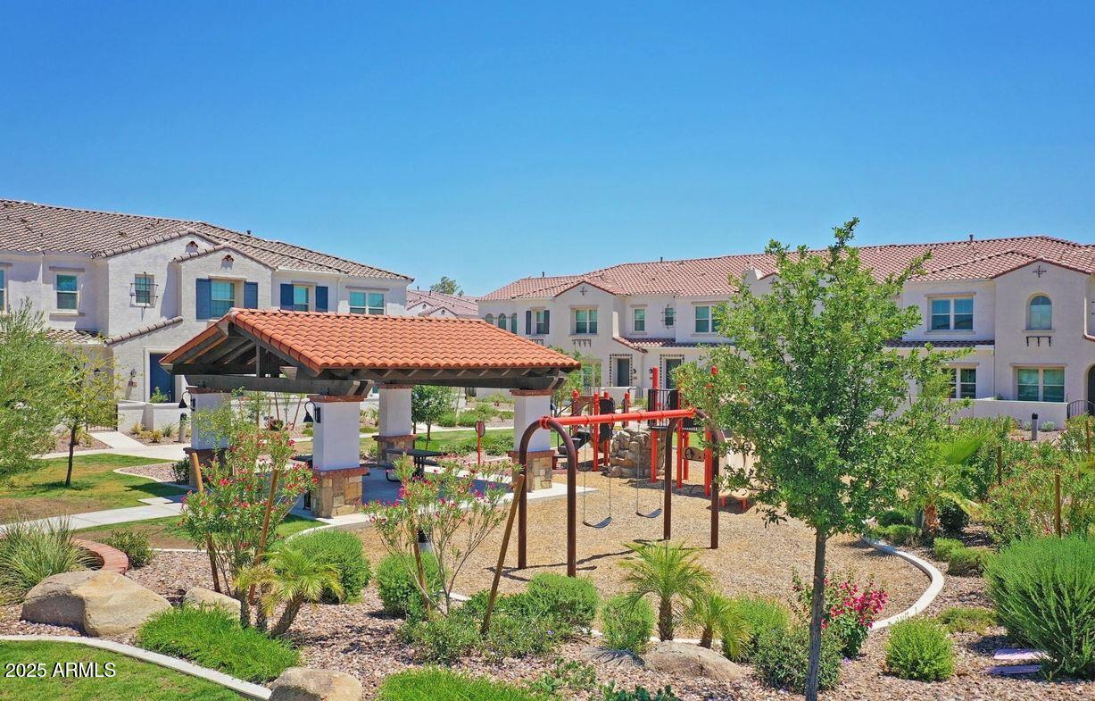 4077 South Sabrina Drive, Unit 30 Chandler, AZ 85248 - Photo 35 of 37 a front view of a house with a garden