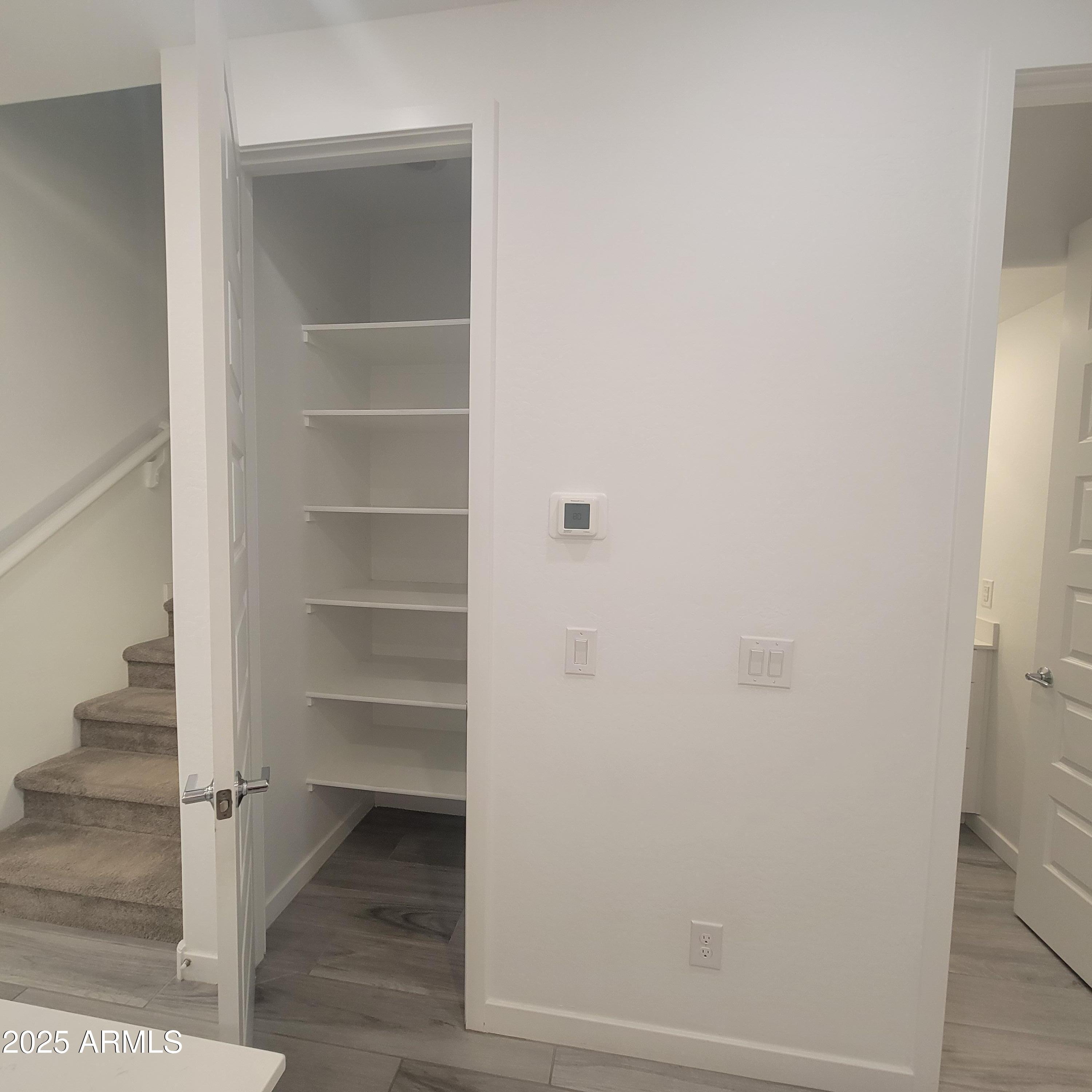 4077 South Sabrina Drive, Unit 30 Chandler, AZ 85248 - Photo 8 of 37 a view of walk in closet with empty racks