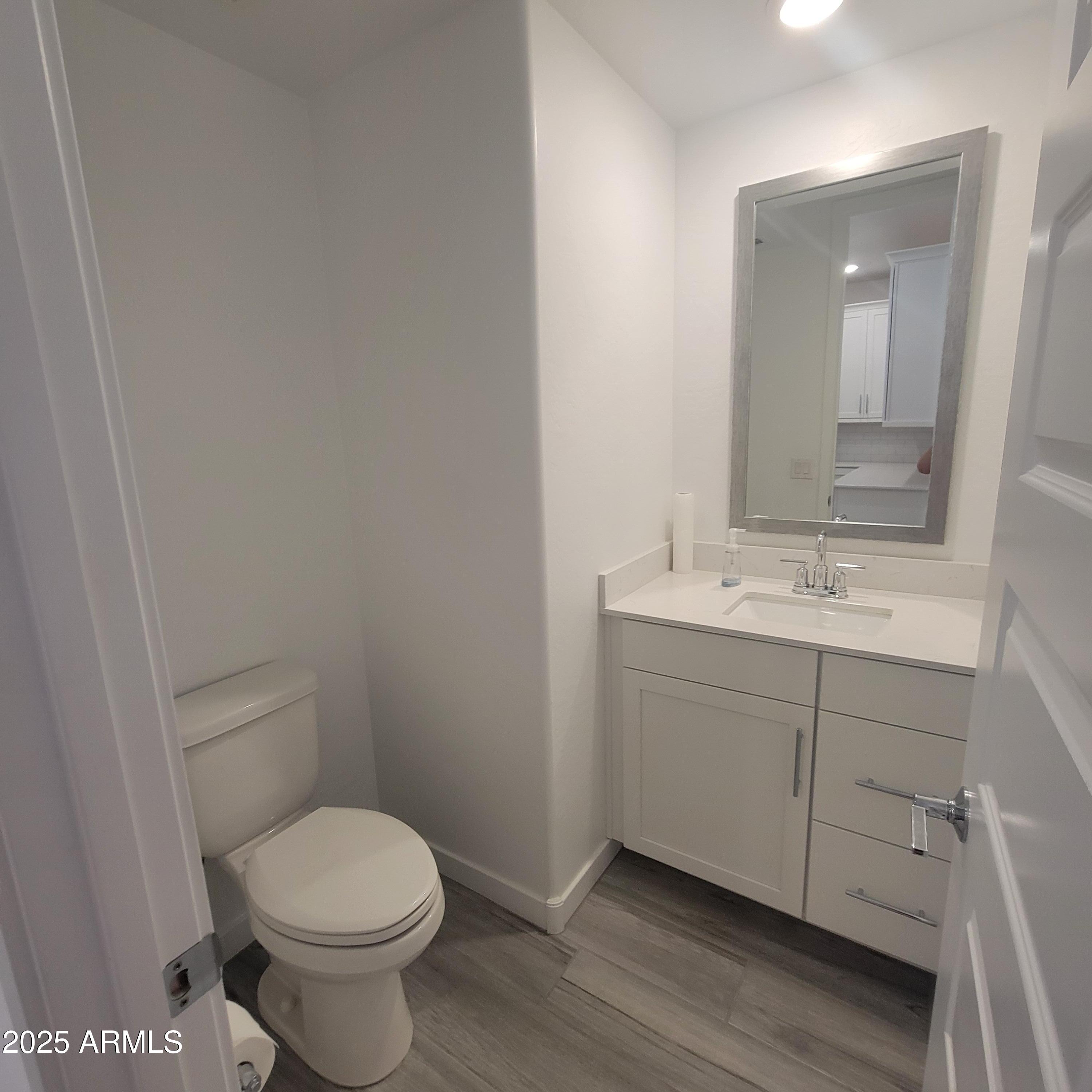 4077 South Sabrina Drive, Unit 30 Chandler, AZ 85248 - Photo 9 of 37 a bathroom with a sink toilet and vanity
