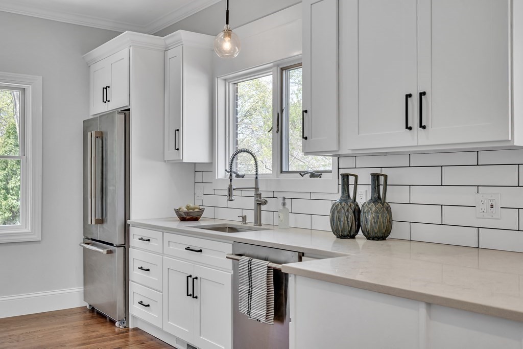 6 Regent Road Belmont, MA 02478 - Photo 13 of 29 a kitchen with white cabinets and window