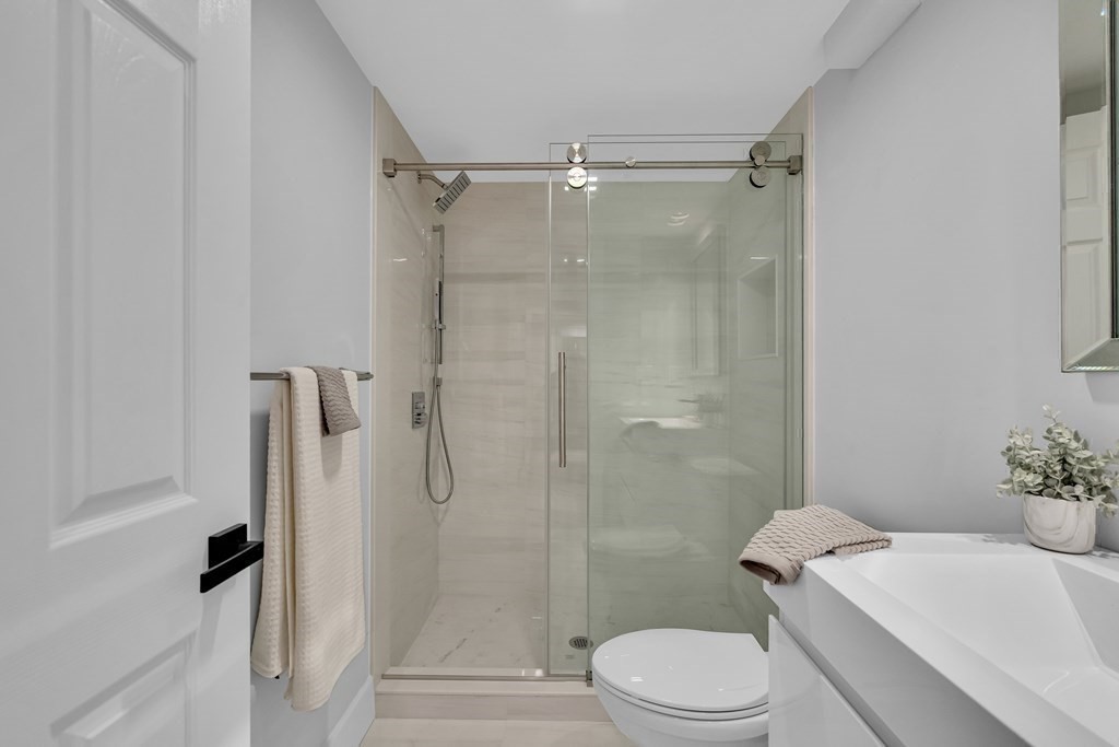 6 Regent Road Belmont, MA 02478 - Photo 18 of 29 a bathroom with a toilet sink and shower
