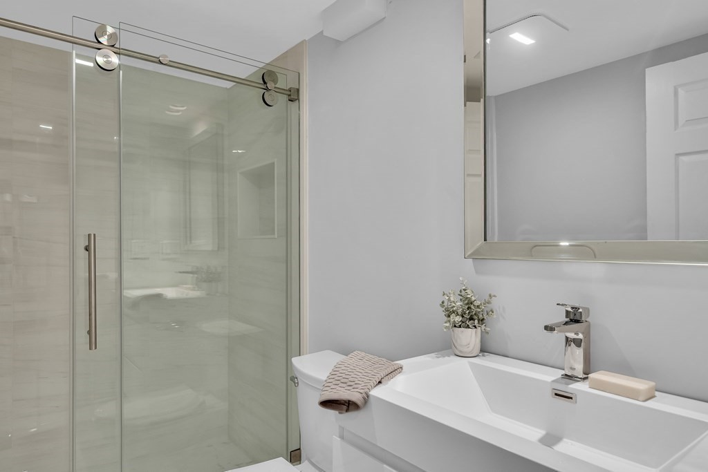 6 Regent Road Belmont, MA 02478 - Photo 19 of 29 a bathroom with a sink toilet and shower