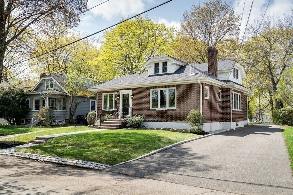 6 Regent Road Belmont, MA 02478 - Photo 29 of 29 a front view of a house with a yard and plants