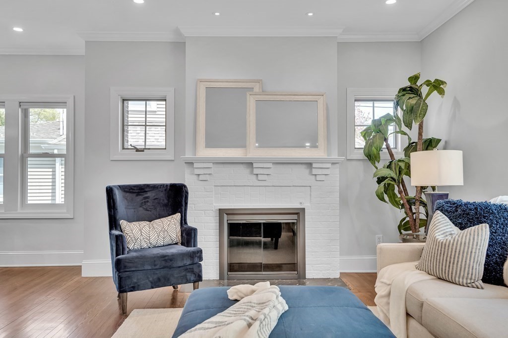 6 Regent Road Belmont, MA 02478 - Photo 4 of 29 a living room with furniture and a fireplace