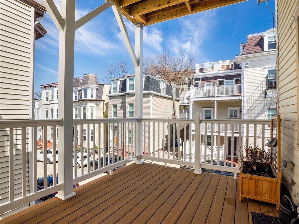 58 Telegraph Street, Unit 2 Boston, MA 02127 - Photo 12 of 17 a view of a balcony with wooden floor