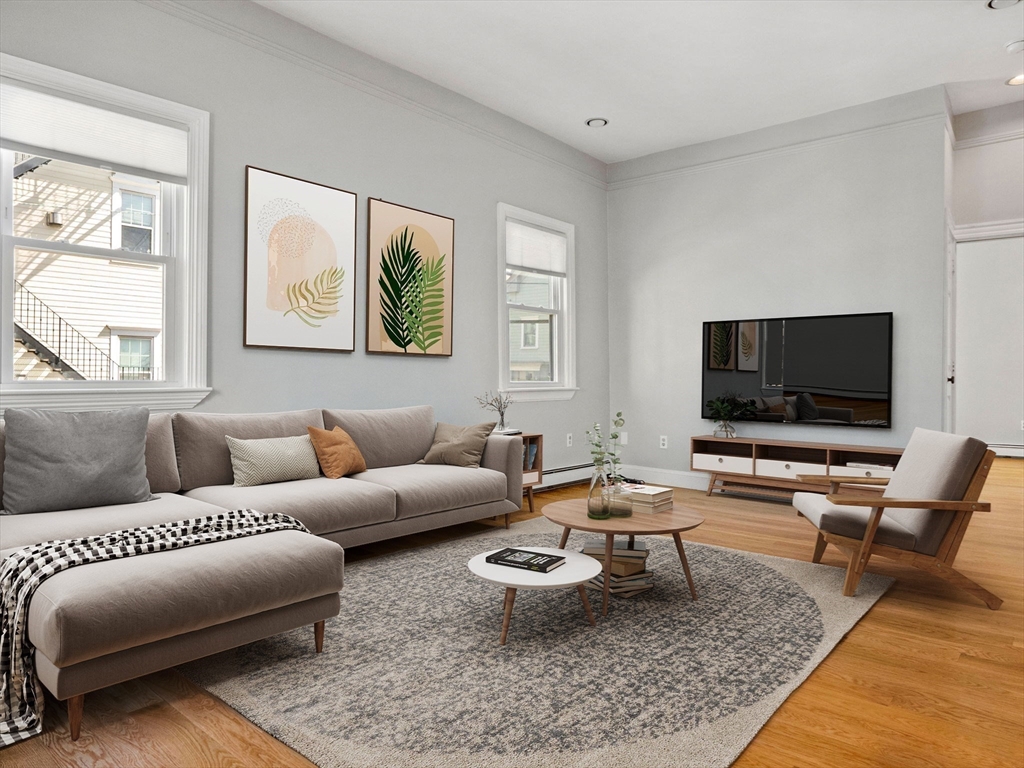 58 Telegraph Street, Unit 2 Boston, MA 02127 - Photo 3 of 17 a living room with furniture and a flat screen tv
