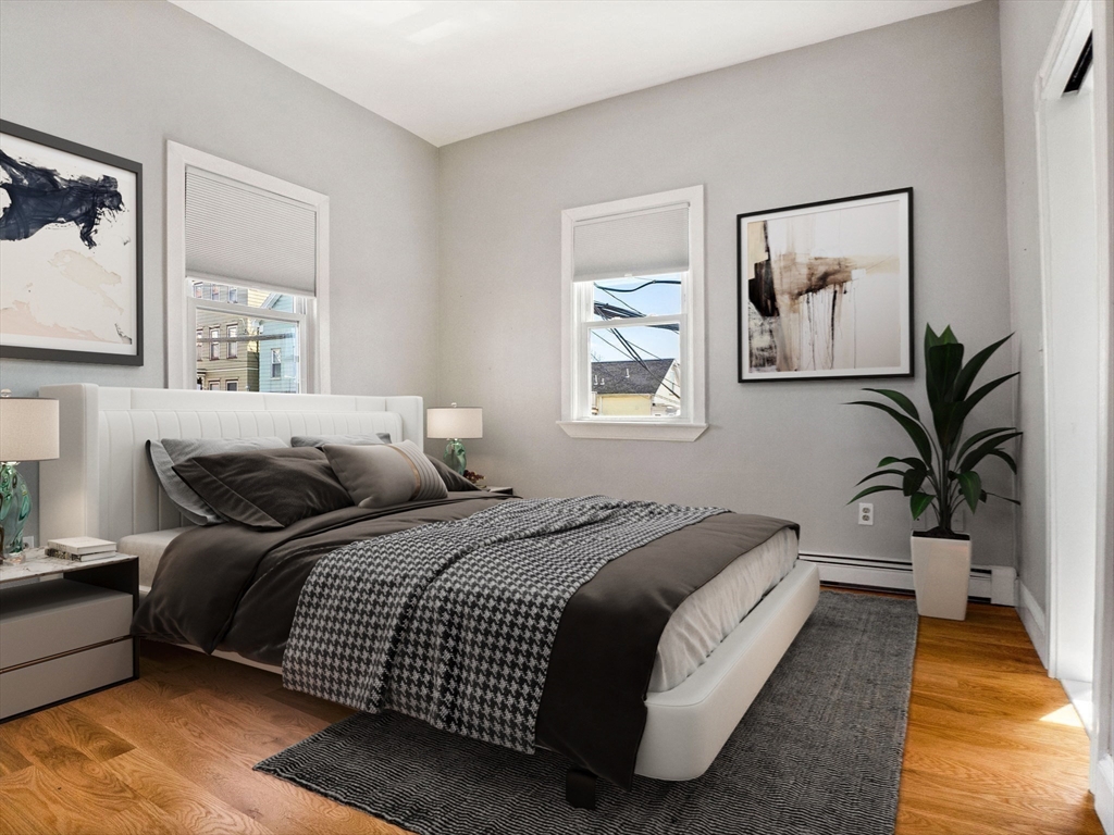 58 Telegraph Street, Unit 2 Boston, MA 02127 - Photo 9 of 17 a bedroom with a large bed and a window