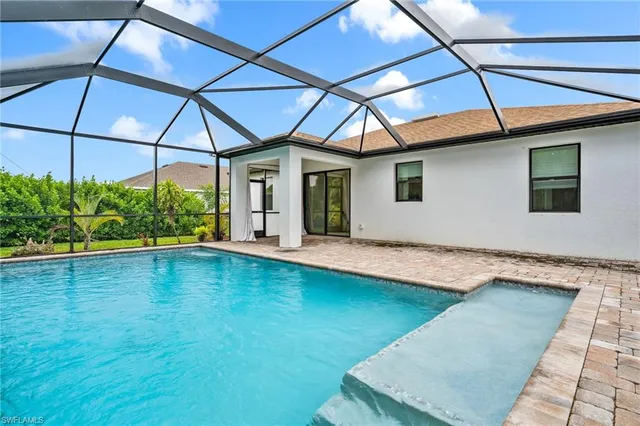 a view of a backyard with a patio and plants
