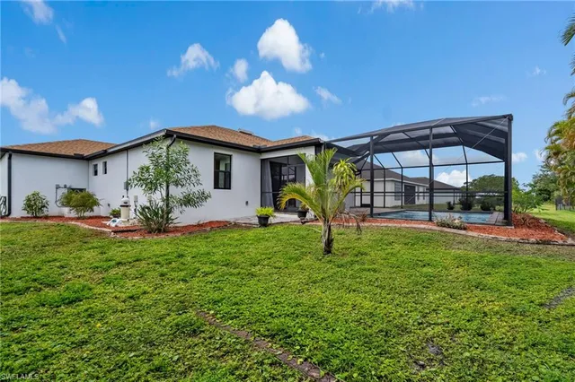 a view of a backyard with a garden and plants