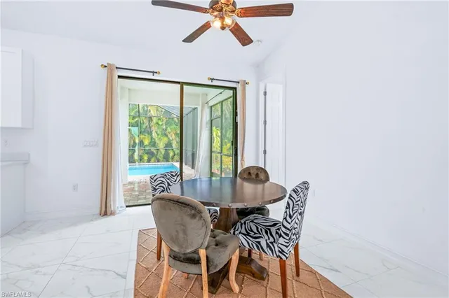 a dining room with furniture and window