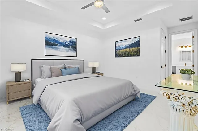 a bedroom with bed and painting on the wall