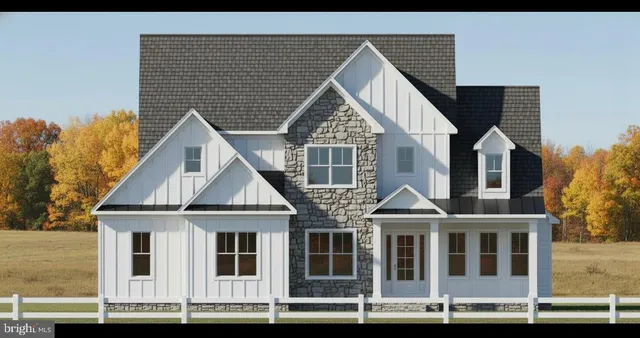 a view of a house with wooden fence
