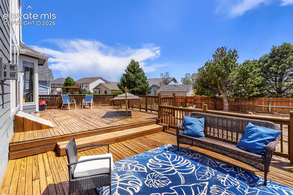 8939 Kingston Heath Road Peyton, CO 80831 - Photo 29 of 31 Backyard Deck 2